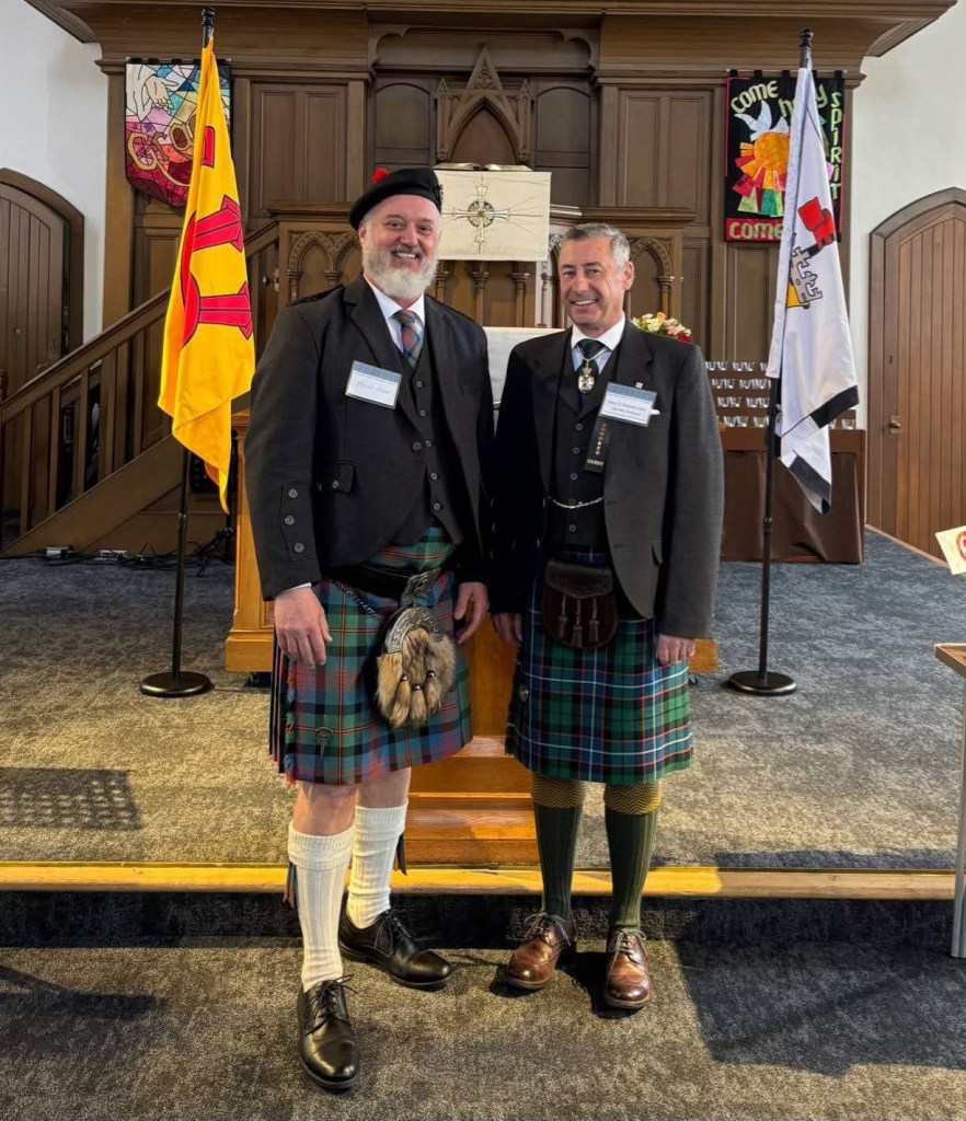 This image shows Kevin Logan, Commander Elect of Clan Logan, with Colin Russell, Bute Pursuivant, at the Global Clan Logan Family Convention in April of 2025.